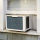 An air conditioning unit sticking out a window.